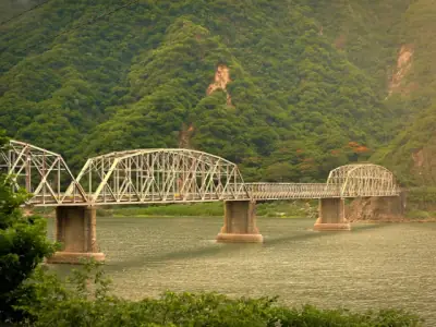 Scenic view of Old Quirino Bridge spanning the Abra River in Ilocos Region, Philippines.