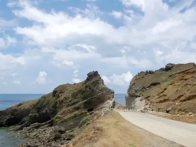 Explore the rocky coastal landscape of Alapad Pass in Batanes, Philippines.