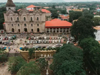 Stunning aerial view of Taal Basilica and surrounding town in the Philippines, showcasing historic architecture.