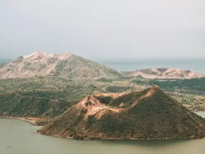 A tranquil aerial view of Taal Volcano and Lake in the Philippines, showcasing natural beauty.
