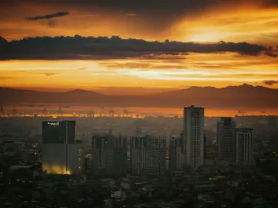 Breathtaking view of Manila's skyline at sunset, showcasing vibrant colors and cityscape.