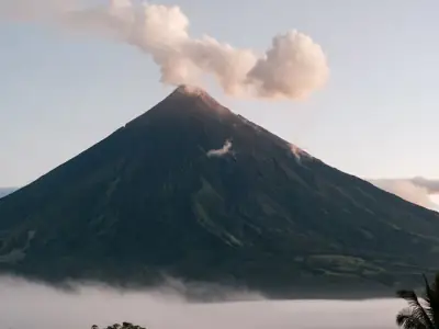 Stunning view of Mayon Volcano emitting smoke in Bicol, Philippines.