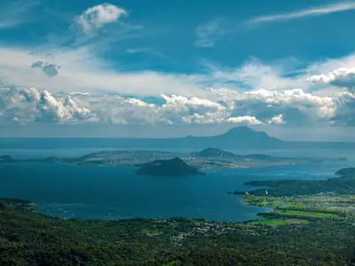 A breathtaking view of Taal Lake and Volcano in Tagaytay, Philippines under a clear blue sky.