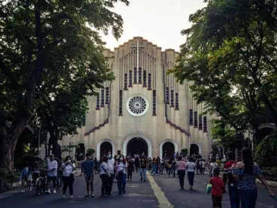 Crowd in front of St. Andrew's Cathedral, Parañaque, NCR, Philippines, during daytime.