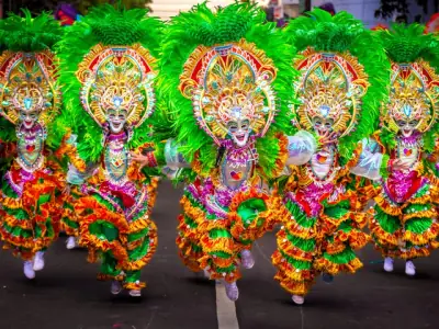 Colorful dancers in traditional attire at the MassKara Festival, Bacolod, Philippines.
