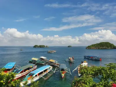 Hundred Islands a group of boats floating on top of a body of water