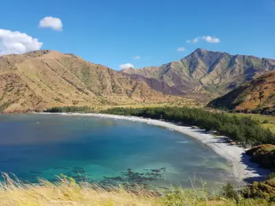 A breathtaking view of Zambales mountains and coastline in Central Luzon, Philippines, captured under a clear blue sky.