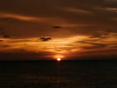 A captivating sunset over the sea with a warm yellow sky in Dipolog City, Philippines.